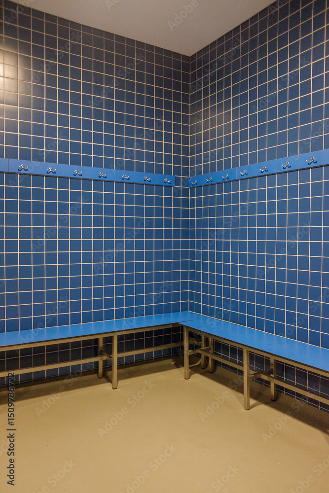 Fototapeta premium indoor swimming pool amenities: changing area perspective geometric pattern of tiles in a vacant changing area