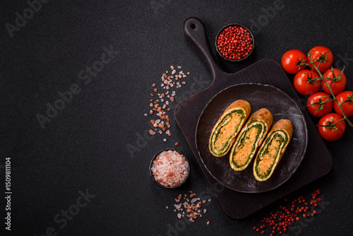 Roll of omelette, spinach, cheese and minced meat