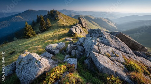 Serene mountain landscape at sunrise with warm atmospheric light and tranquil scenery in early morning nature