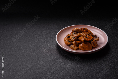 Food, baked mushrooms champignon slices with sauce and spices