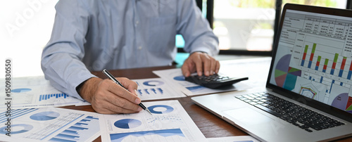 business analyst analyzing operating results from business and financial report. Concept of business planning ,accounting, business analysis,financial planning,data analysis.