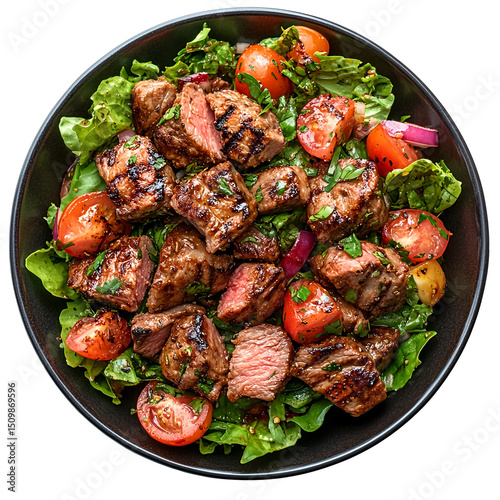 Top view of a delicious looking Fattoush Salad with Grilled Meat on a dark porcelain plate isolated on a white transparent background