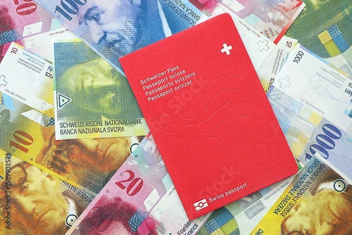 Swiss franc banknotes and passport. The current francs money bills and biometrical pass photo