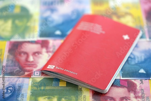Swiss franc banknotes and passport. The current francs money bills and pass lies on table photo