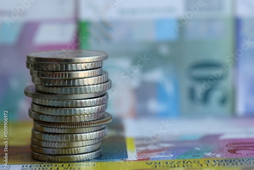 Swiss franc banknotes and coins. The current francs money bills and coins lies in big amount photo