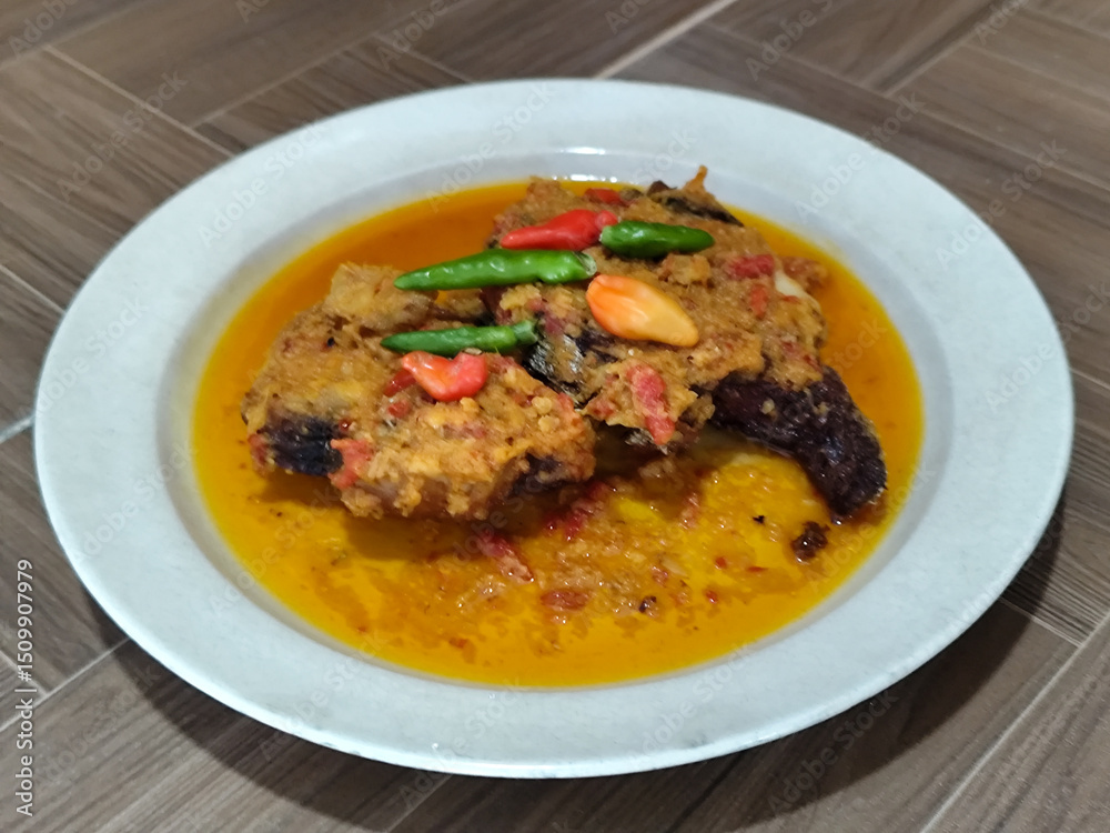 Tilapia with yellow curry, a traditional Indonesian dish, which has a delicious taste, beautifully presented. Tilapia with yellow curry, a traditional Indonesian dish, which has a delicious taste, beautifully presented.