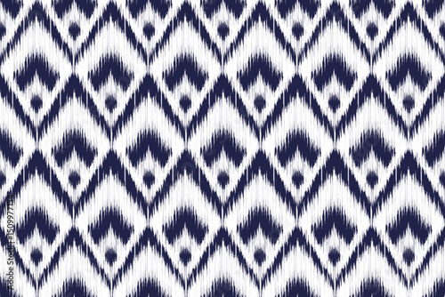 Seamless ikat pattern featuring blurred indigo diamond shapes on a white background, perfect for textile design, digital papers, or modern decor.