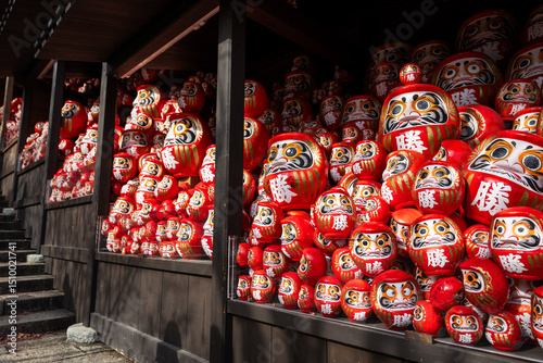 Osaka, Japan - December 2024: Scenic view of Katsuoji Temple in Minoh during peak autumn season. Beautifully framed by vibrant red and orange maple leaves, reflecting the serene atmosphere of autumn.