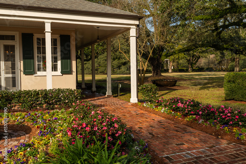Photographs of a former plantation near New Orleans capture historic mansions, grand oak-lined avenues, and remnants of antebellum architecture