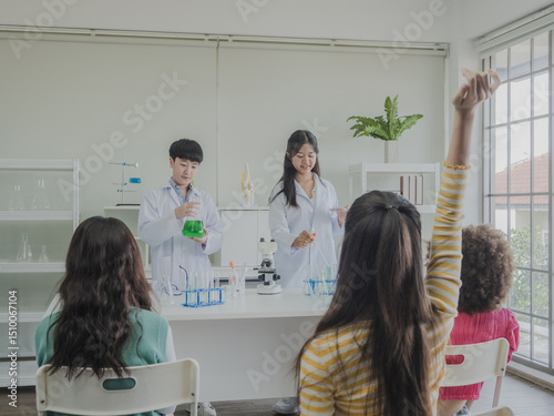 Child kid girl and boy asian young education student team group learning and smile have fun happy enjoy with science lab technology with in school class room has tubetest microscope chemicals  table