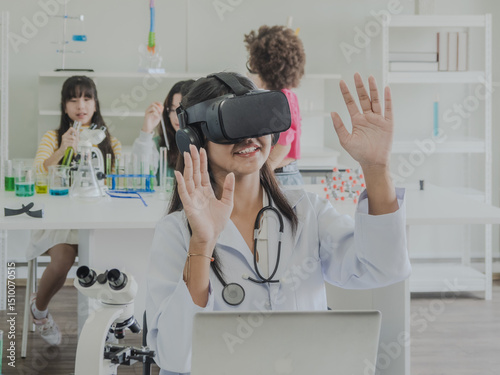 Child kid girl asian young student one people endication learning and smile have fun happy with science lab technology with in classroom look hand holding 3D glasses virtual simulation technology