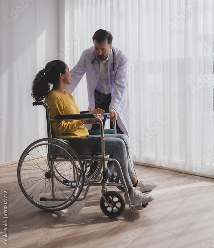 Health care latin woman sick sit wheelchair with man doctor caucasian two people check and treat patients talk help support explain medicine sick person in take care your health hospital clinic