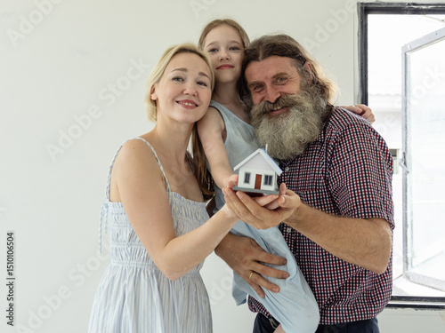 Couple husband father wife mother and child daughter cute white people smile cheerful together look inspection new home dream construction interior building property with love care happy family time