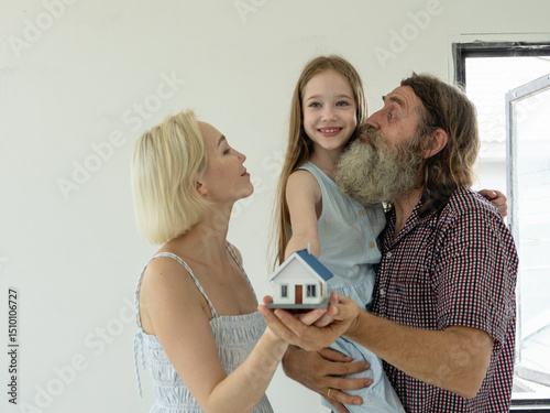 Couple husband father wife mother and child daughter cute white people smile cheerful together look inspection new home dream construction interior building property with love care happy family time