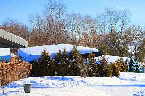 Winter landscape, tourist houses in the forest on a hillside