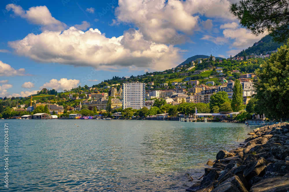 Fototapeta premium Montreux, Switzerland, with hillside buildings and Lake Geneva. Montreux is located in the centre of a region named the Vaud or Swiss Riviera.