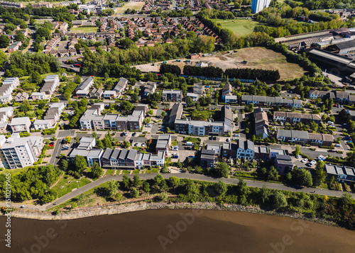 Dunston Gateshead UK: 15th May 2025: View of a contemporary residential area in Dunston along the River Tyne, highlighting green landscaping, roadways, and nearby communities. Drone pov photo