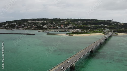 Wallpaper Mural 4K focus on road over Long bridge of Kouri Island and beach from a high view by drone with clear sky and sea water. Torontodigital.ca