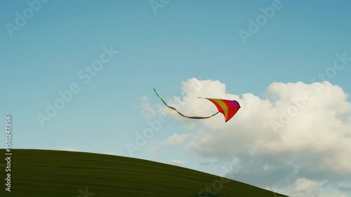 Serene Sunset Kite Flight over Rolling Green Hill