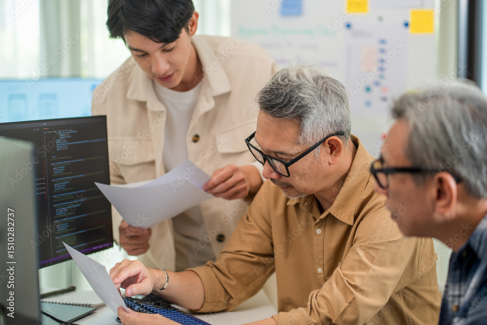 Obraz premium Asian developer leading a digital innovation class, teaching students about coding, software development, and web programming in a tech-savvy environment. 