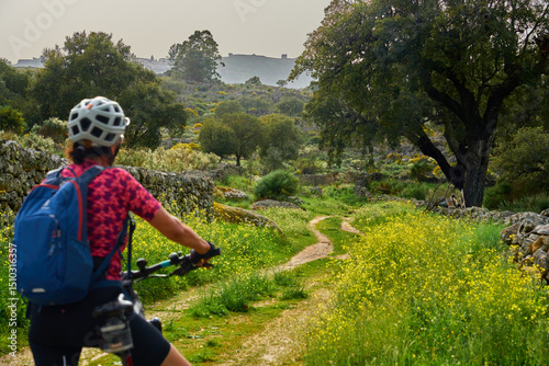 active senior woman cycling...