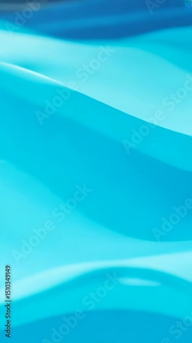 Smooth blue gradient waves flowing continuously creating elegant abstract motion background with soft transitions and fluid movement