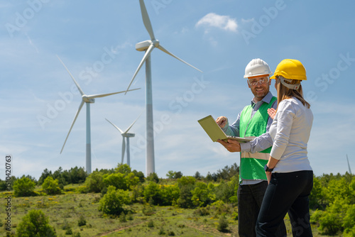 Two engineers working in a wind turbine field