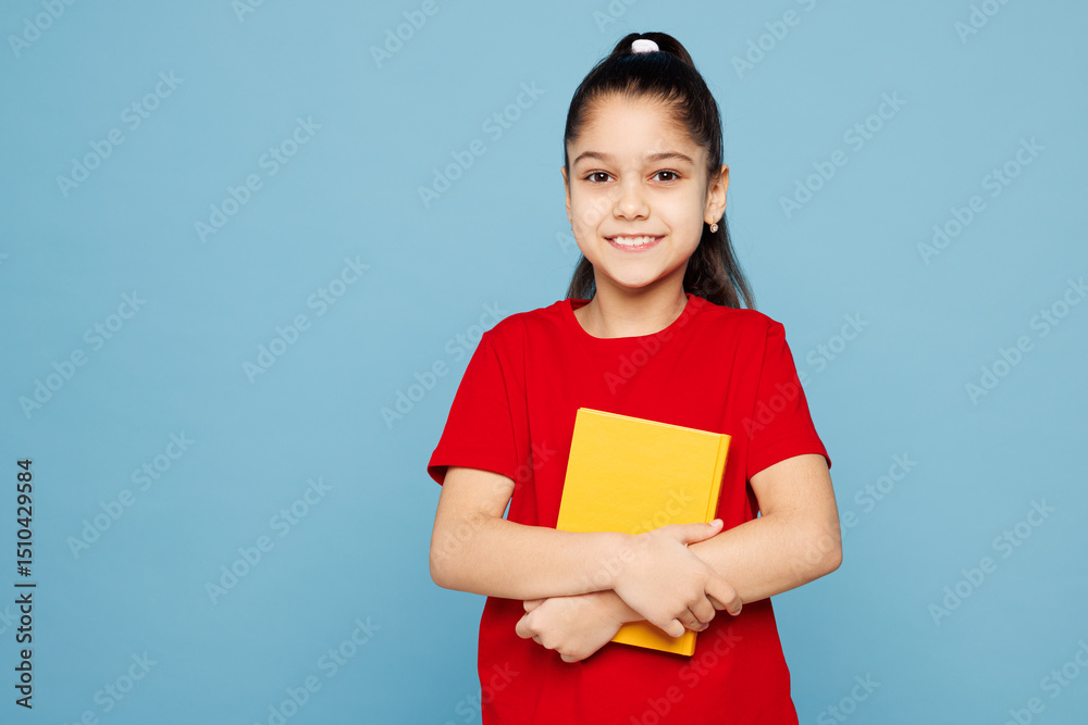 Obraz premium Little kid girl 8-9 years old wears red t-shirt have fun holding read book look camera isolated on pastel light blue color background child studio portrait. Mother's Day love family lifestyle concept.