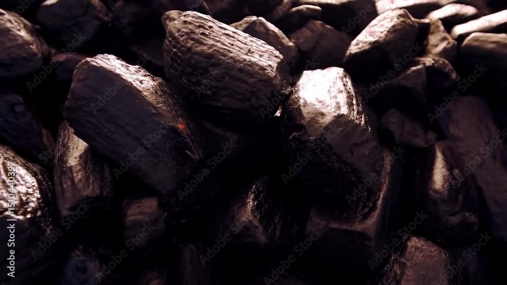 Dark, irregularly shaped pieces fill the frame