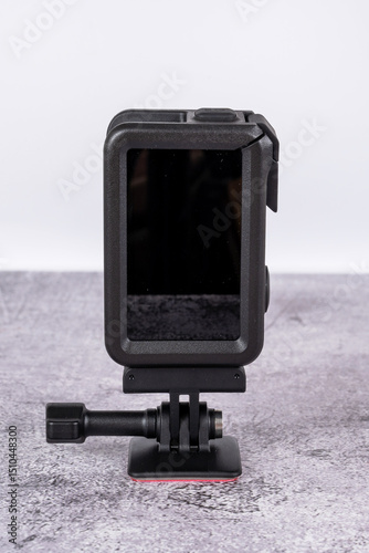 black action camera front view placed on the table