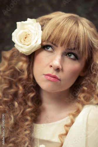 Woman With Rose In Hair