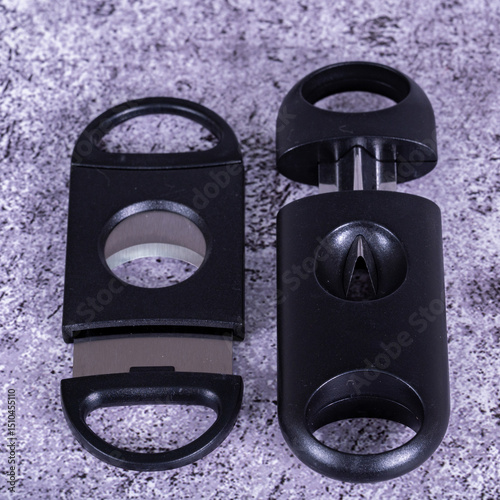 A black cigar cutter isolated placed on the table