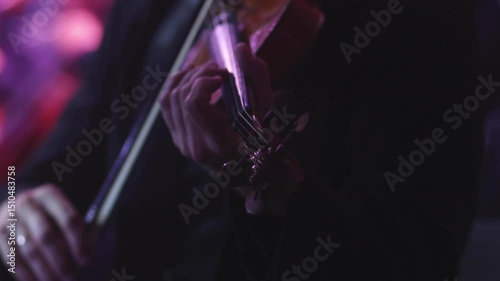Concert view of violinist with vocalist and musical band, fiddler performing classical music, symphony orchestra performing music, violin player on stage in a club, music arena hall, fiddle and bow
