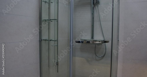This video features a modern bathroom with a stylish shower stall