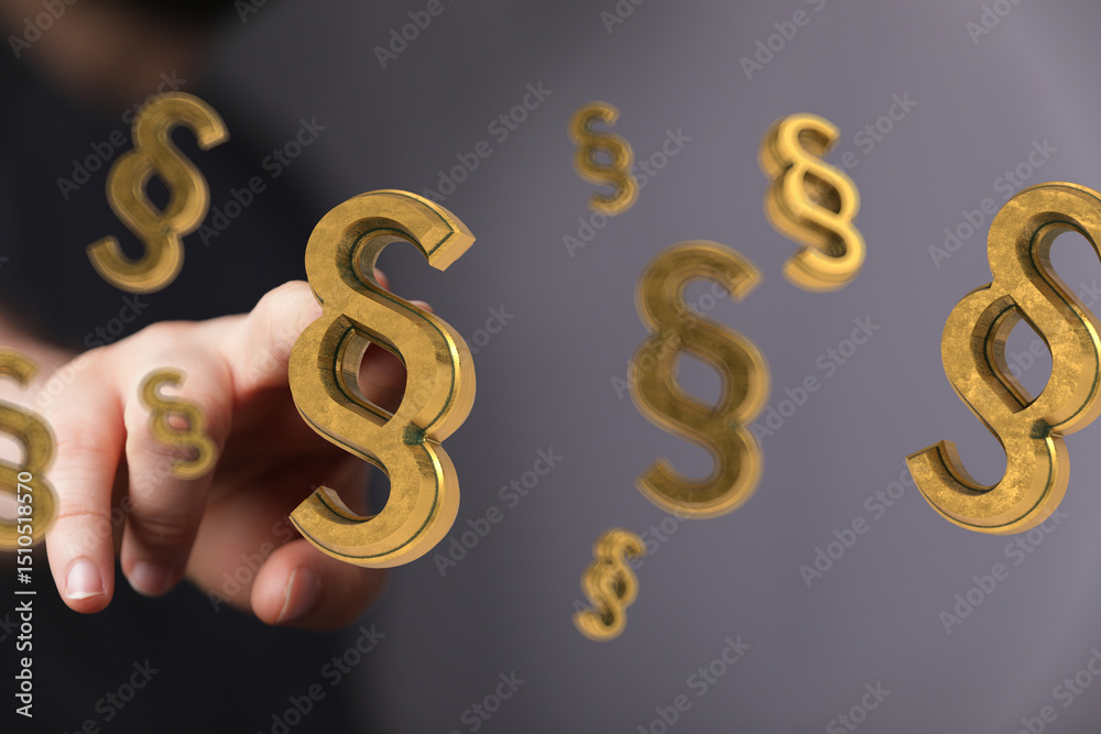 Abstract image of a hand and golden paragraph symbols. Ideal for legal, law, and justice related projects. Abstract image of a hand and golden paragraph symbols. Ideal for legal, law, and justice related projects.