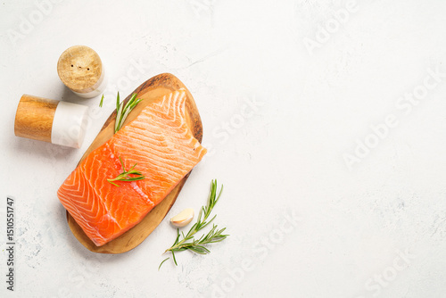 Salmon fish with herbs on white background.