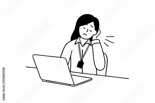 A woman is sitting at a desk with a laptop and a badge on her. She is wearing a white shirt and she is in pain