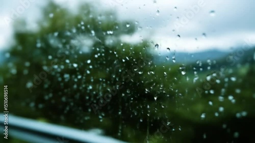 Rain Falling on Car Window in Forest Scene