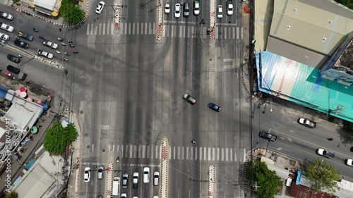Aerial view of traffic intersection in Bangkok Thailand with cars and urban street