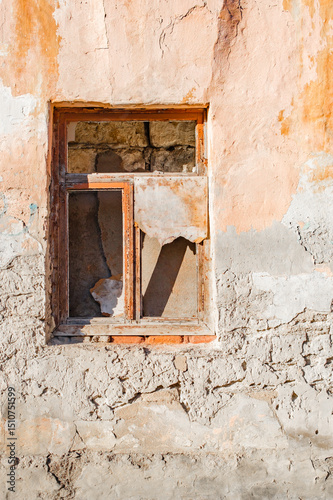 broken glass in old window of house