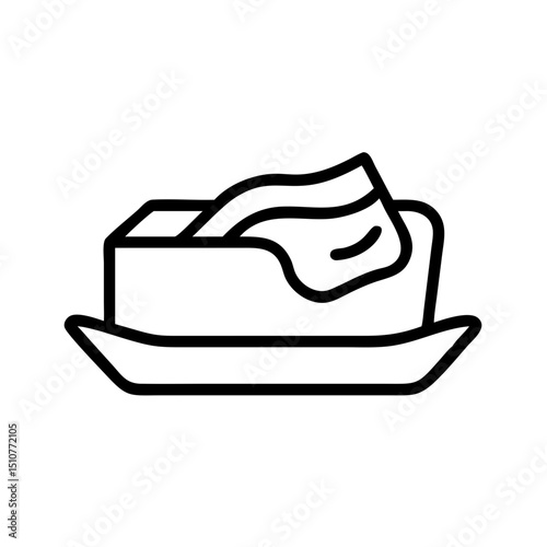 Butter on a plate with a knife resting on top  
