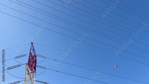 High voltage towers on a blue sky background. Electrical power lines. Green energy,electricity station concept,4K