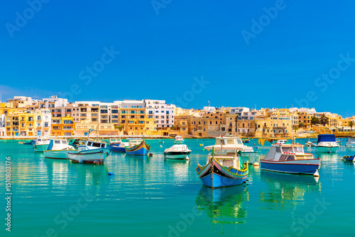 A view of numerous fishing boats in St George's Bay in Birzebbuga, a small coastal town in Malta