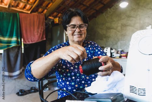 May 25th, Seamstress' Day, lady practicing the art of sewing in her home