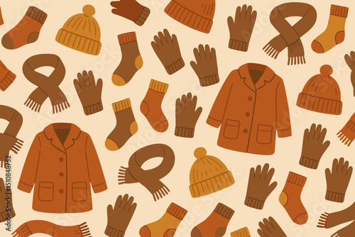 Cozy winter accessories and clothing in warm colors create a cheerful seasonal pattern for optimal comfort and style