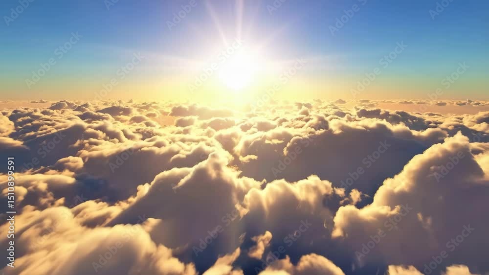 Flying high above the clouds at sunset, an aerial view of a layer of cloudscape and the sun shining brightly in the blue sky.
