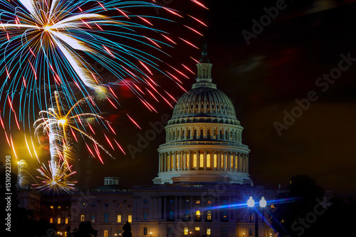 Fireworks burst above Capitol dome building during Fourth of July nighttime celebration in Washington D.C.