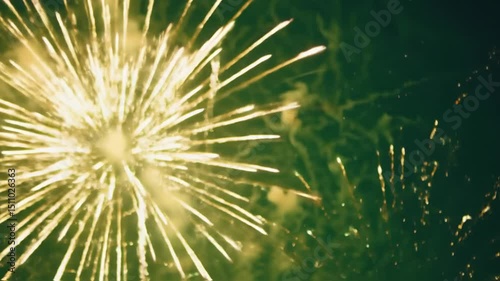 The breathtaking and mesmerizing fireworks are lighting up the vast night sky, creating vibrant green hues that dazzle