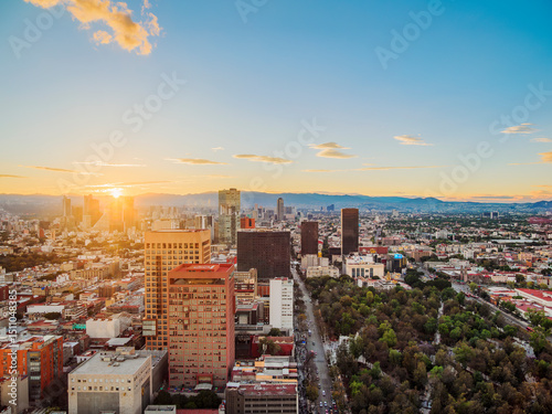 View over Alameda Central towards High-rise buildings of Paseo de la Reforma at sunset, Mexico City, Mexico