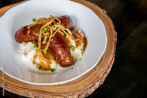 Bangers and Mash-Irish sausage on top of a mount of mashed potatoes  photo